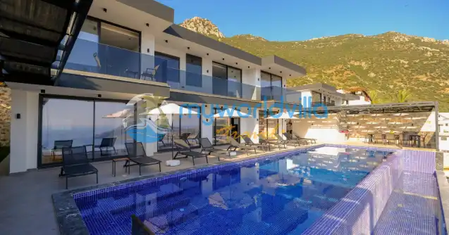 Antalya Kaş Kalkan mevkiinde konumlanan Villa Elit 2 beş yatak odalı on kişilik konaklama kapasitesine sahip lüks villalarımızdan biridir. Mavinin büyüleyici tonları içerisinde lüks tasarımı ve modern yapısı ile sizlere rüya gibi bir tatil imkanı sunuyor. Kalabalık aileler ya da arkadaş grupları için en ideal deniz manzaralı kiralık villamızdır.